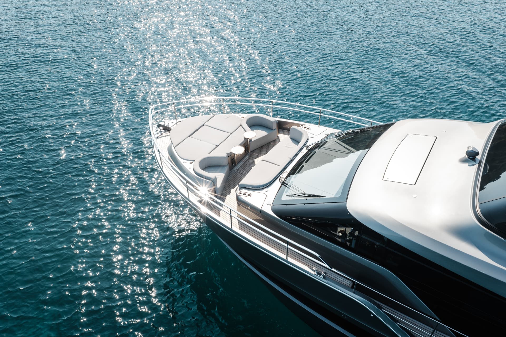 Foredeck lounge in the sun — photo by 007 Media
